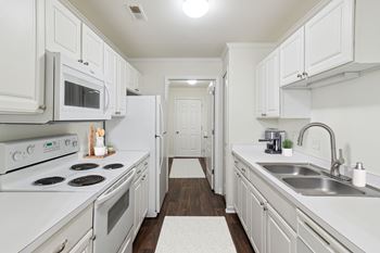 Fully Equipped Kitchen with White Appliances